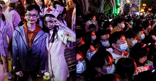 Multidão reunida num parque de diversões em Wuhan para celebrar o Halloween