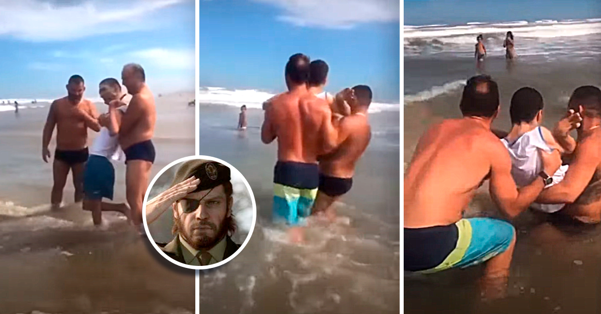 Estranhos ajudam pai a levar o seu filho, que se encontra numa cadeira de rodas, para tocar no mar pela primeira vez